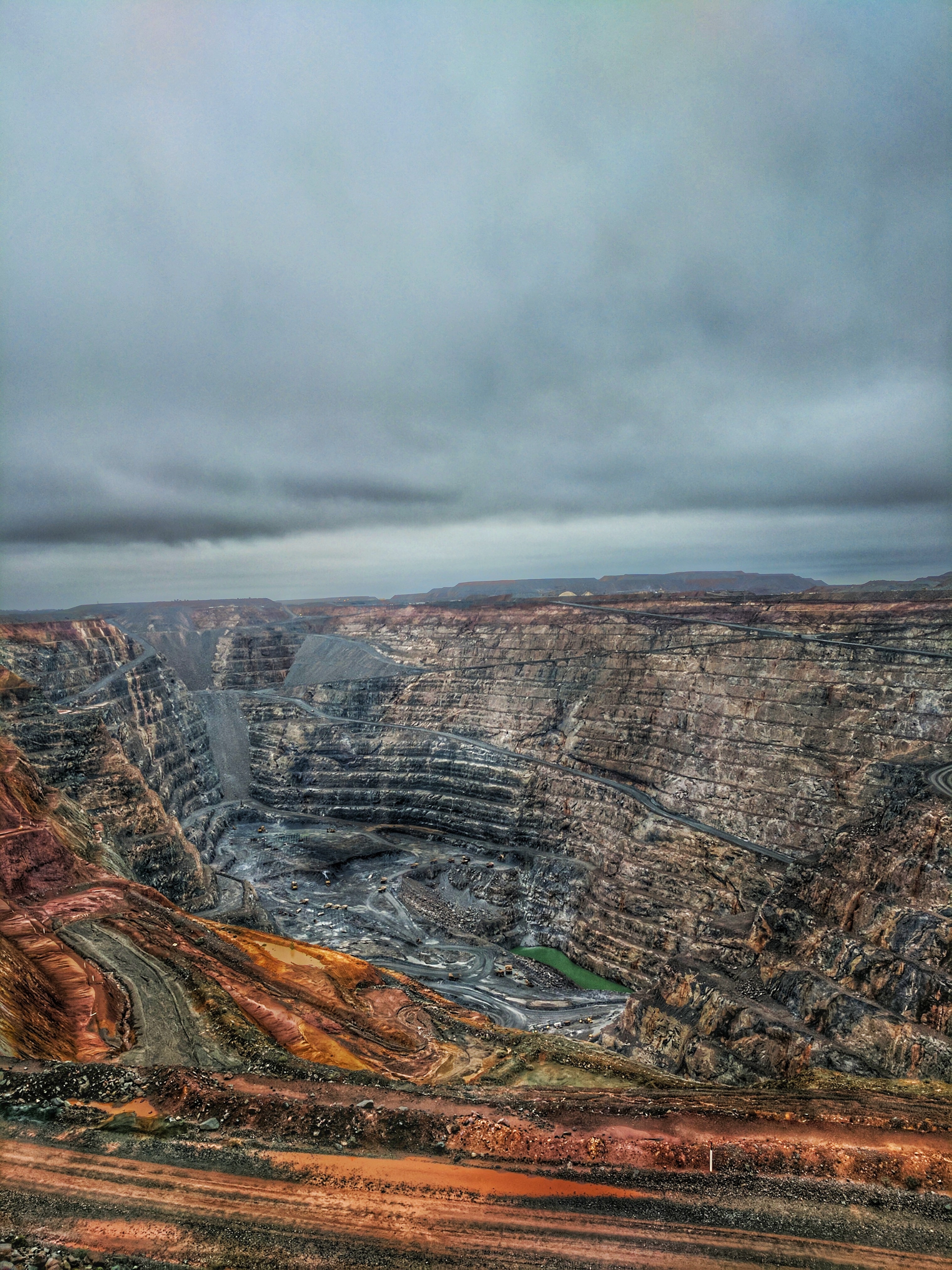 an open-pit mine, a surface mining technique used to extract minerals or rock from the earth by removing the overlying material