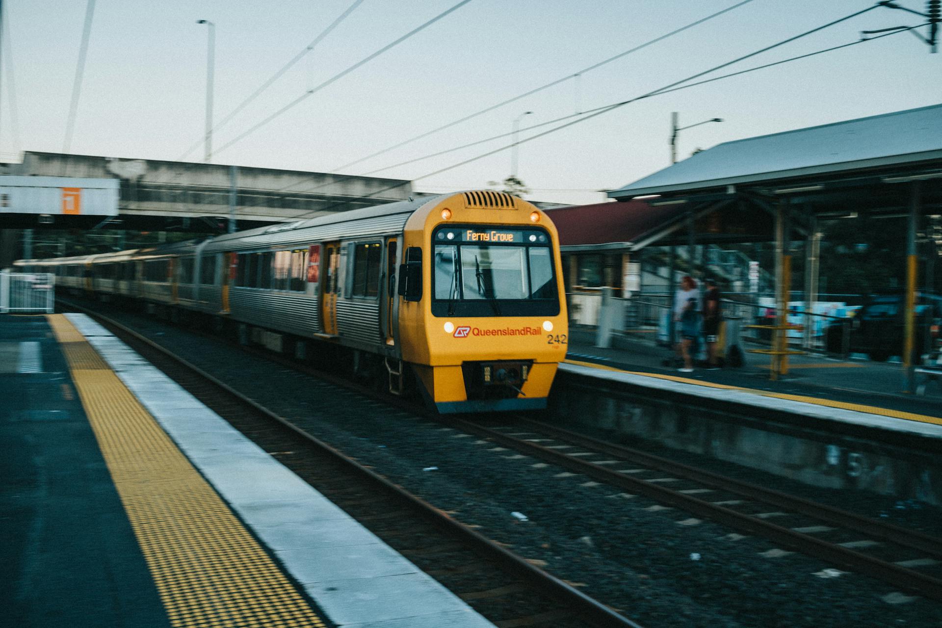 A picture of a train arriving at a station. In Australia, acoustic engineering has been applied at some stations to enhance announcements' sound quality.