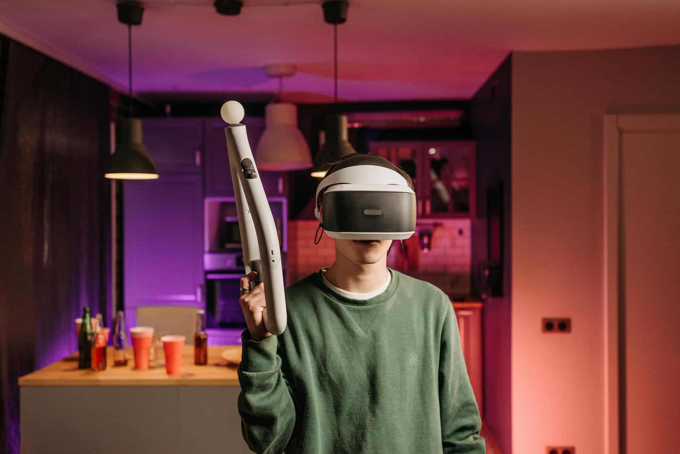 A picture of smart home representation, a young man is wearing VR equipment to play a game.