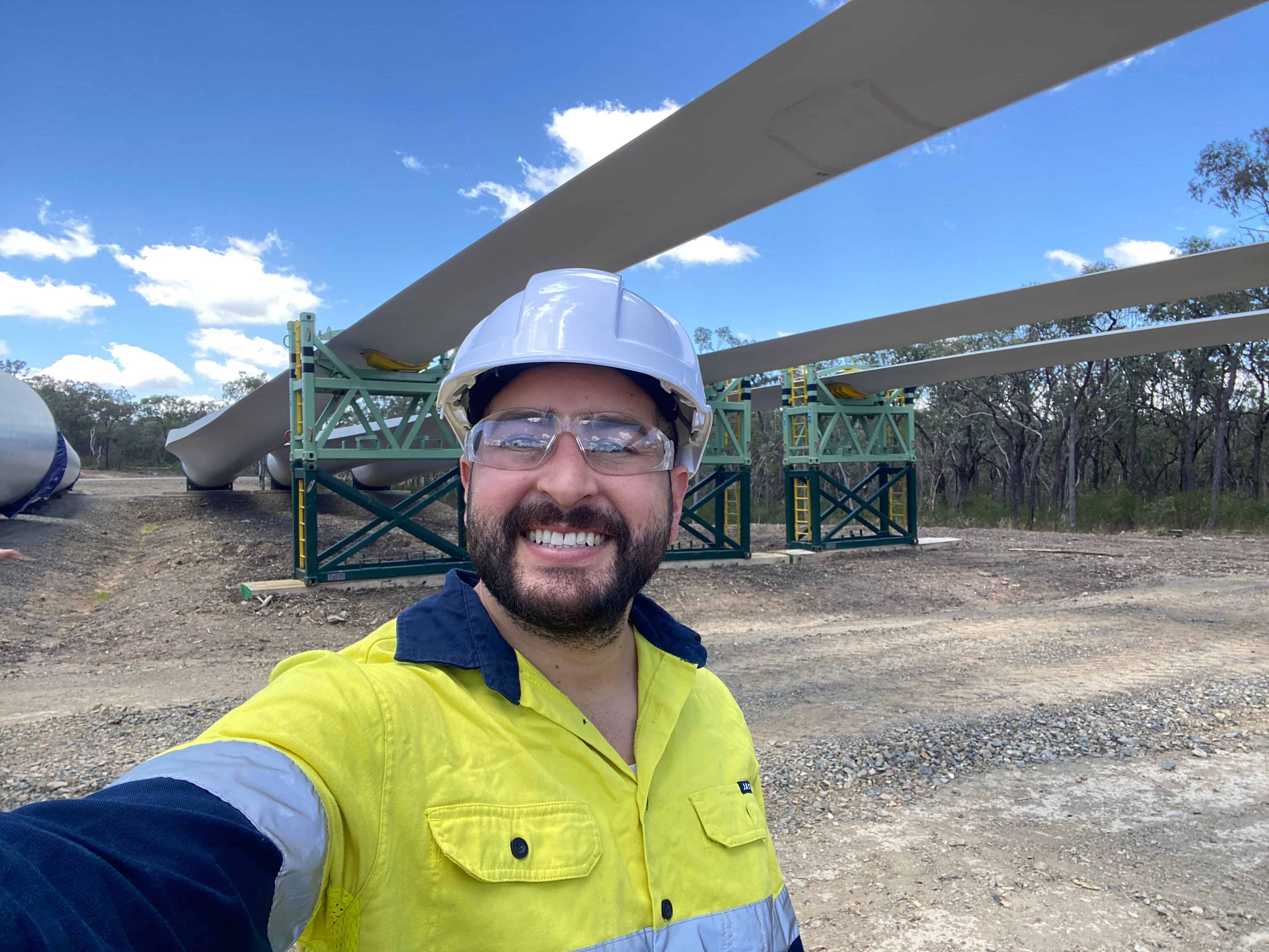 An Australian engineer is posing a selfie at a project site